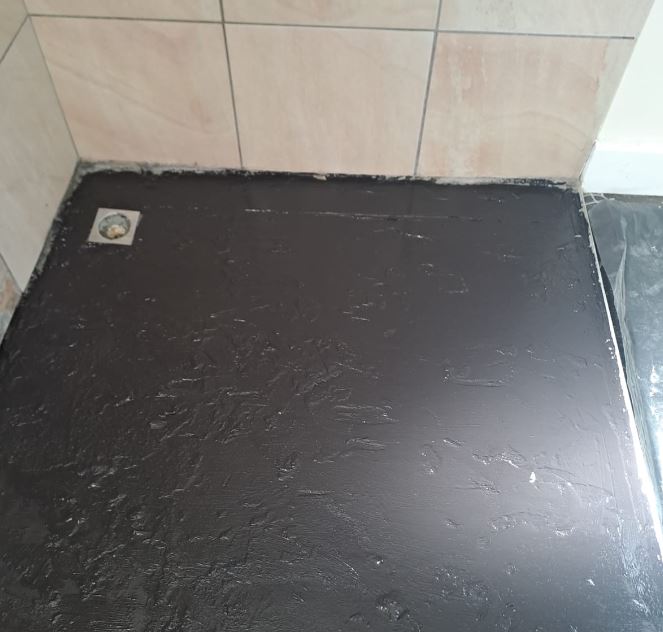 Bathroom shower floor waterproofed with Silkhan liquid rubber under tiles